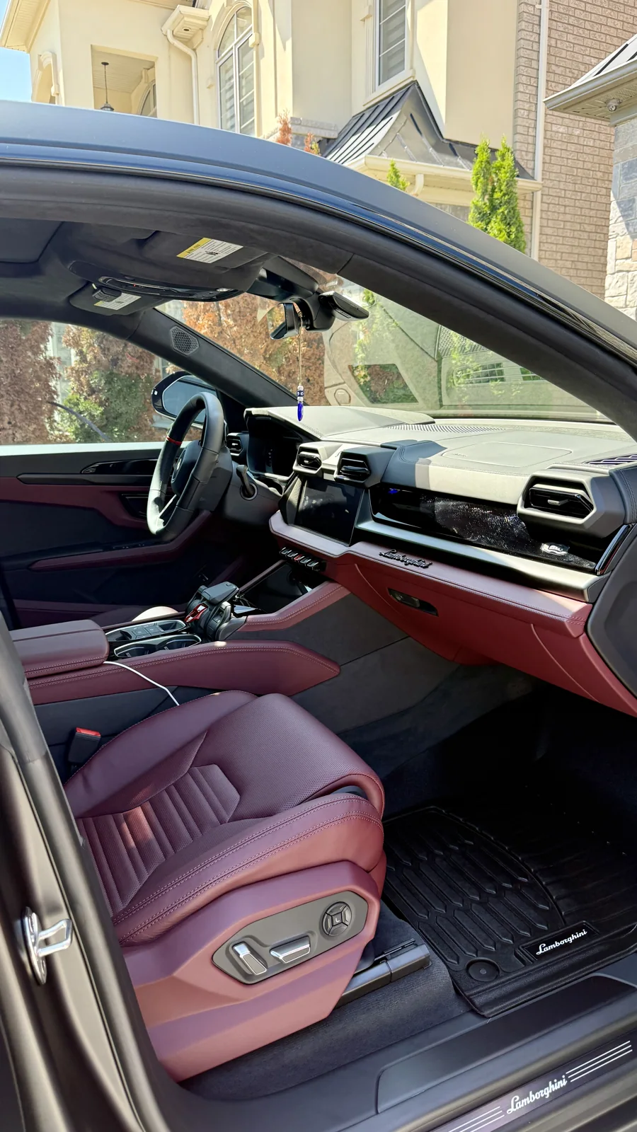 Red leather Lamborghini Urus interior professionally cleaned
